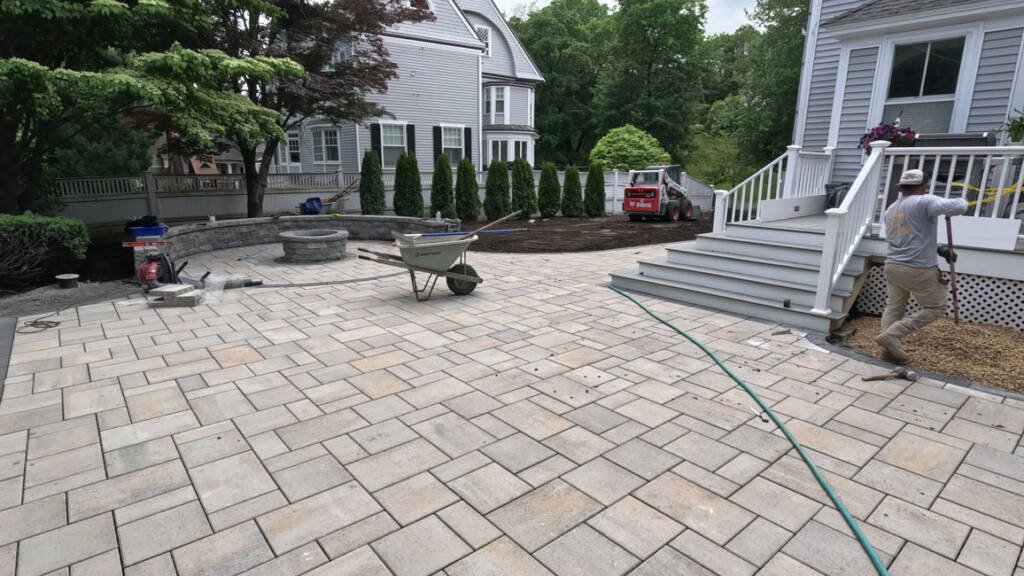 Custom fire pit installation in North Shore MA backyard