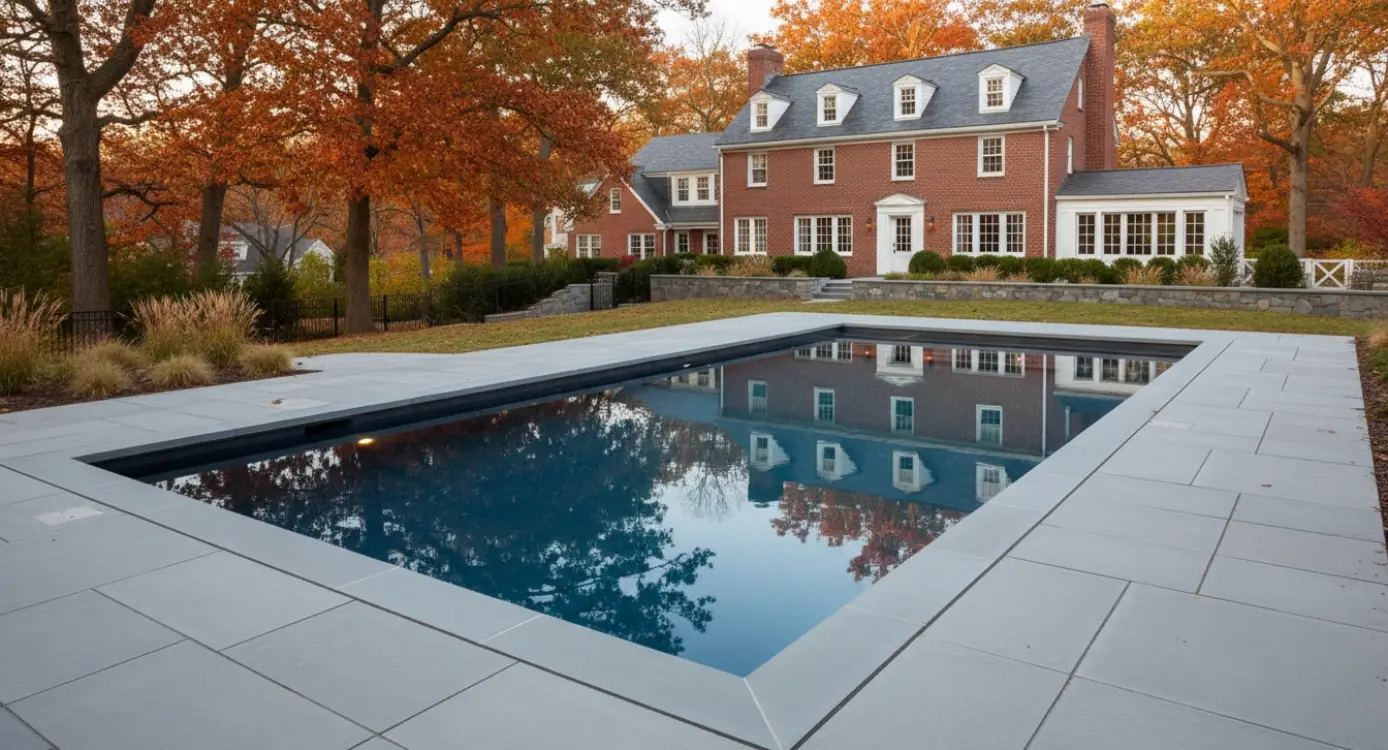 sleek rectangular pool with light stone coping