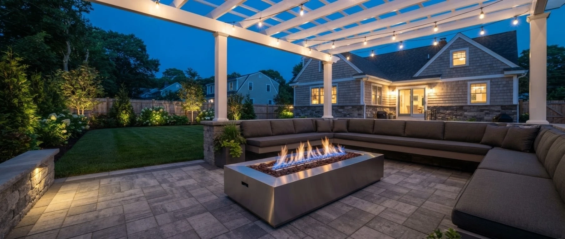 Gas fire pit under pergola Massachusetts backyard