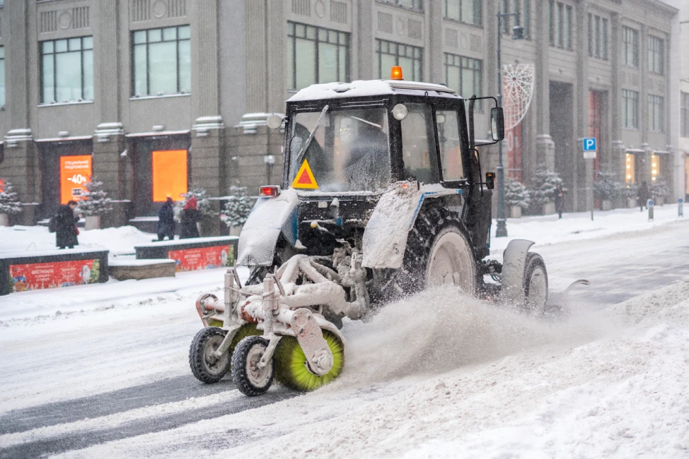 Sidewalk snow sweeping service in downtown Boston MA business district