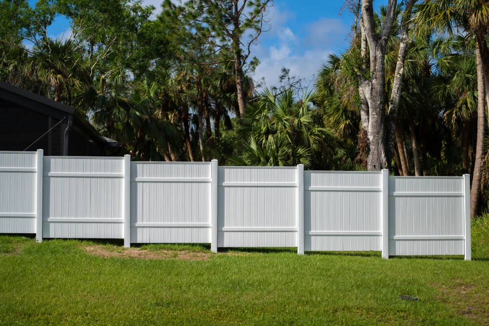 Vinyl fence panels tropical yard palm trees