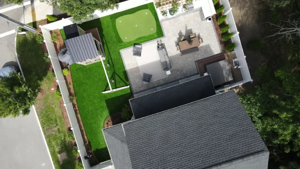 Backyard with artificial turf and putting green