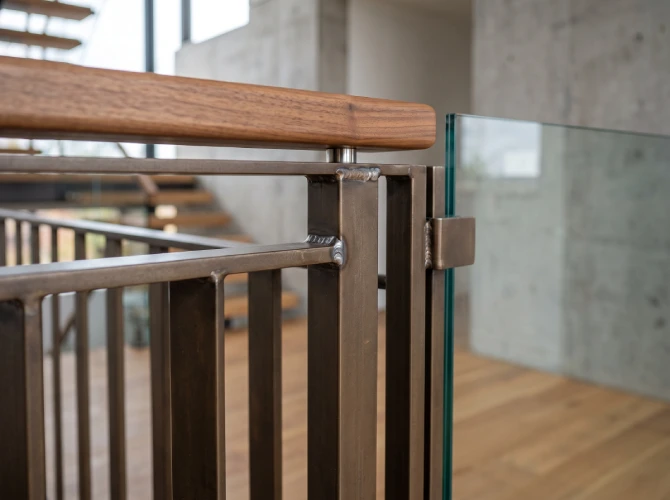 Custom steel railing closeup fabricated welded mixed materials