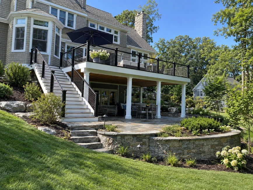 Elevated deck with patio below in Massachusetts