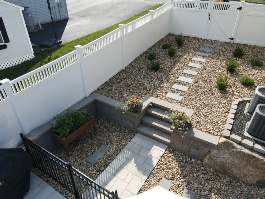 Gravel garden walkway with stone steps and retaining walls Swampscott MA