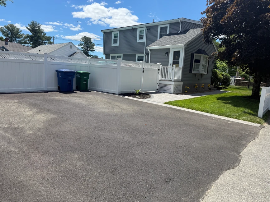 Residential asphalt driveway and paver walkway in Massachusetts