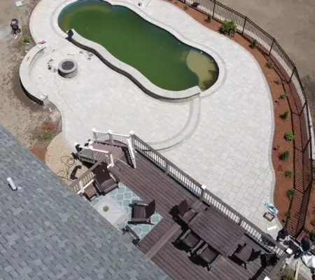 Aerial view of kidney-shaped pool and patio