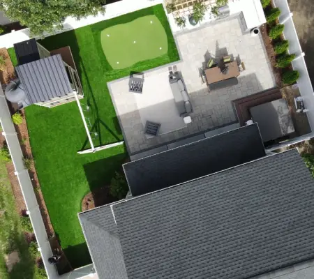 Backyard turf putting green with paver patio, playing areas compact family yard, Malden MA
