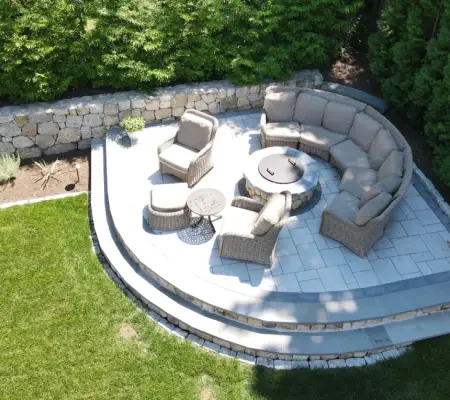 Curved stone seat wall sectional sitting area, Needham MA patio