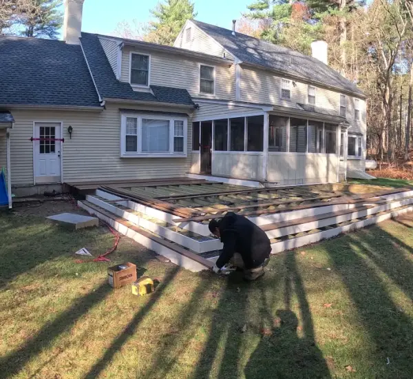 Professional deck framing installation at New England colonial home in Lexington MA