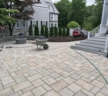 Garden design services in Andover, Massachusetts - patio and arborvitae installation