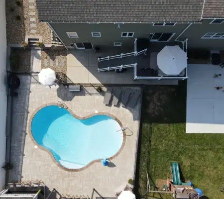 Kidney pool with deck aerial view