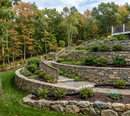 Natural stone retaining wall for sloped yard in Lynnfield MA