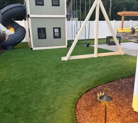 Playhouse with slide on artificial turf ma usa