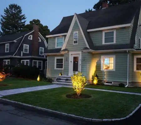 Seasonal color garden lighting in Salem, Massachusetts at dusk
