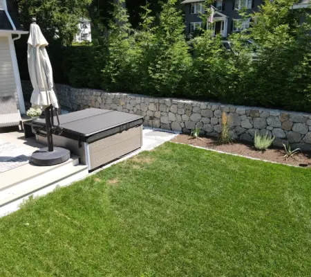 Stone wall plus hot tub patio, MA backyard