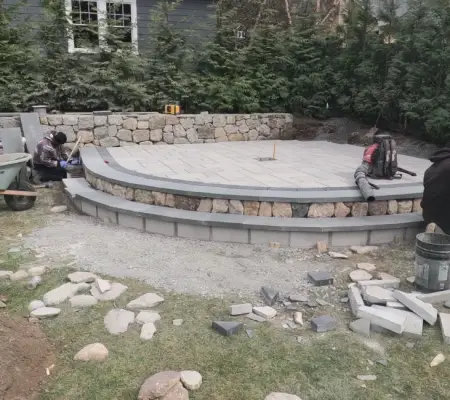 Stone wall with curved raised patio build, MA Concord, MA