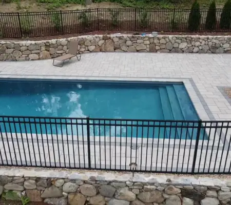 Swimming pool paver patio and stone wall installation Reading MA